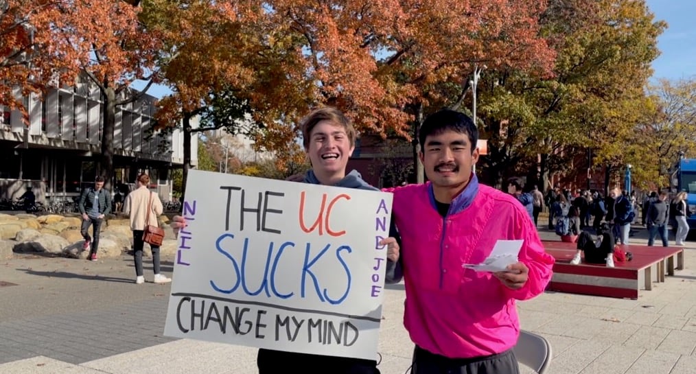 Michael campaigning with Neil Katzman, a member of a different ticket, during the UC presidential election in 2021.