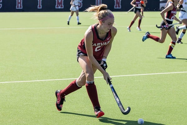 Junior midfielder Avery Donahue drives down the field against the University of Delaware on Sunday. The Crimson defeated Dartmouth 3-2 two days prior.