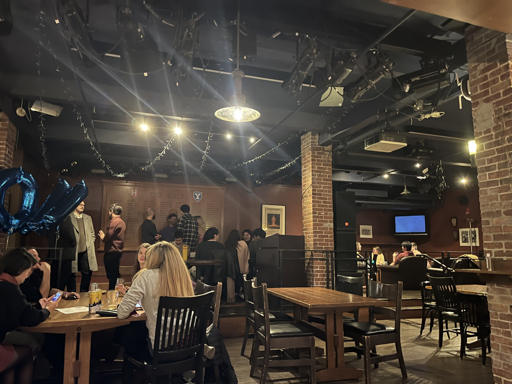 Patrons seated with drinks at the Queen’s Head Pub on Oct. 20, the second day of opening week.