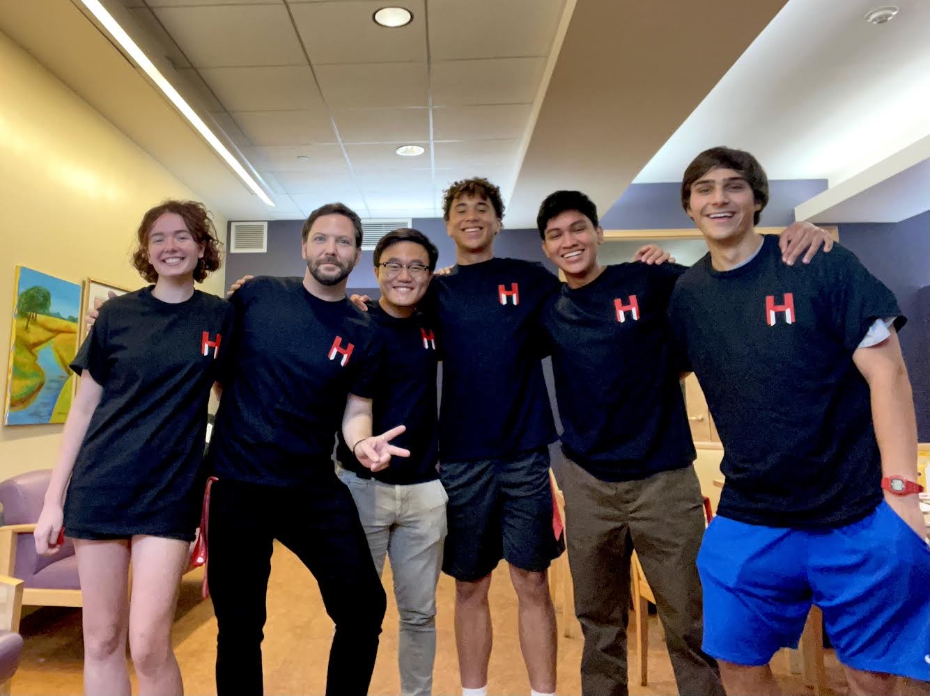 Kody Christiansen stands with a group of student volunteers at the Harvard Square Homeless Shelter.