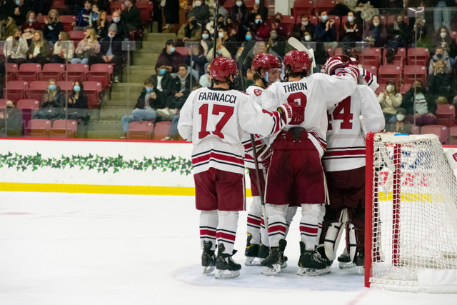 Senior forward and captain John Farinacci huddles against Yale on February 22, 2022. Farinacci returned to play over winter break after an extended injury absence.