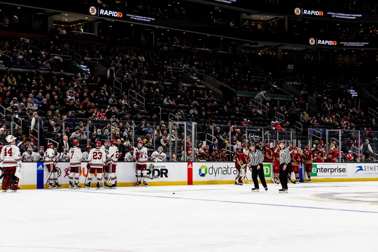 The Harvard men's ice hockey team huddles at the bench in its 2023 Beanpot game against Boston College on February 6 at the TD Garden. The TD Garden announced on March 21 that it would host the 45th playing of the Women's Beanpot in 2024.