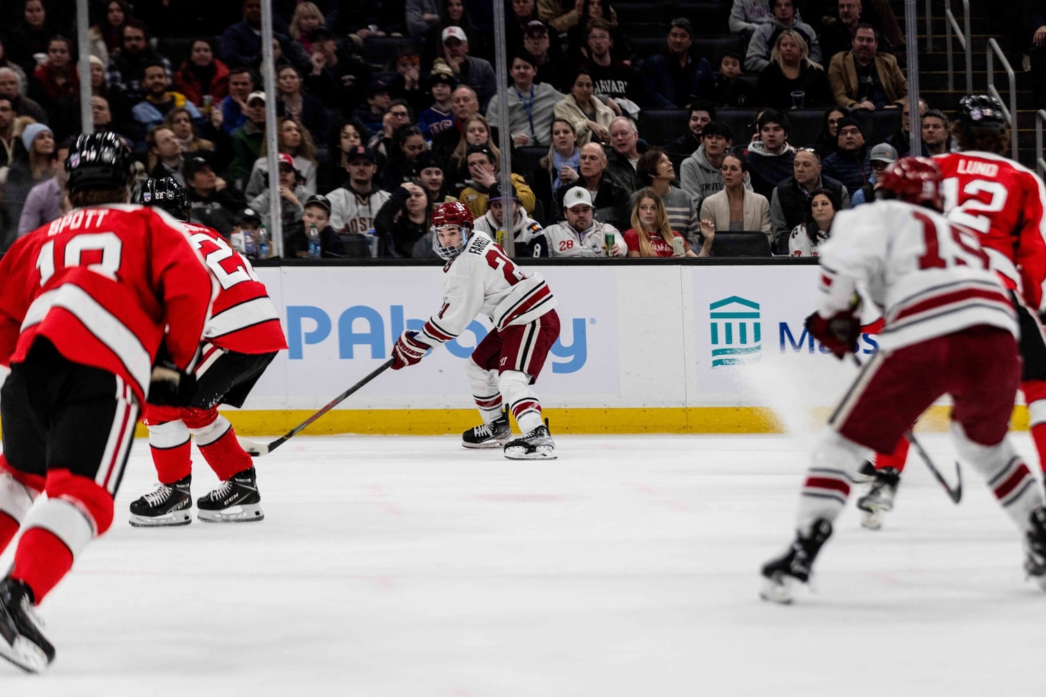 Junior forward Sean Farrell looks for a passing lane in the Beanpot title game on Monday night. Farrell was the Crimson's leading scorer on the season.