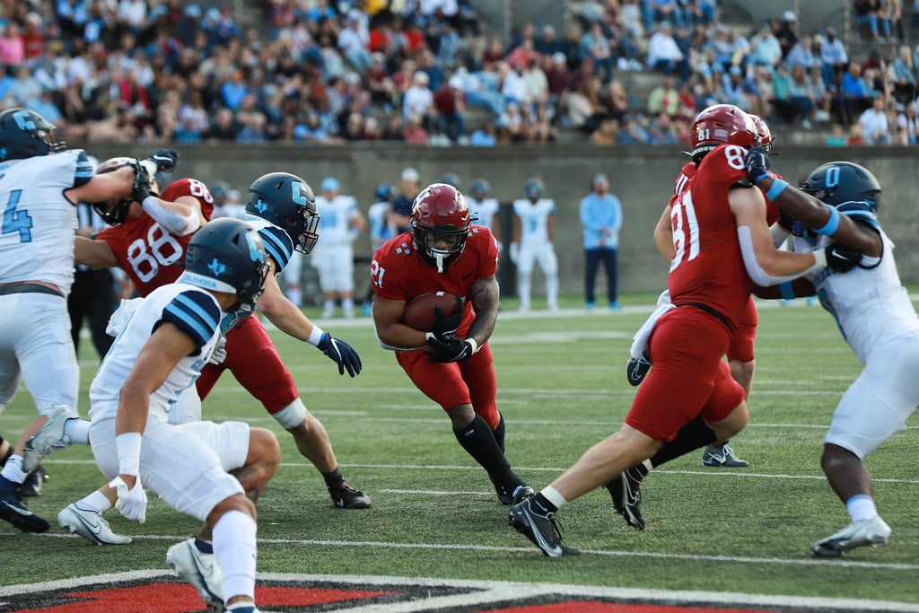 Senior running back Aidan Borguet darts through the Columbia Lions on Nov. 5, 2022.