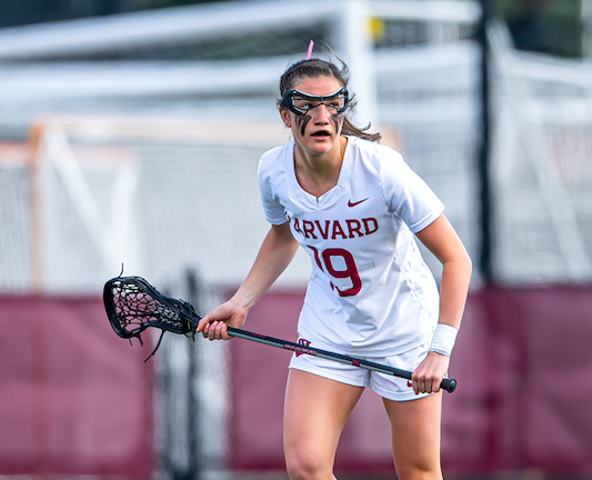 Graduating senior Maggie McCarthy defends the net at a women's lacrosse game. The Medfield, Mass. native also plays for the women's basketball team, where she is a captain.