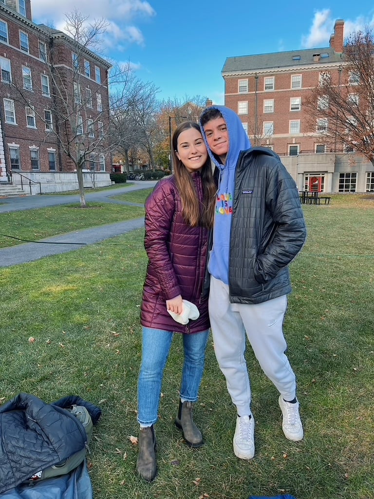 Grace Benkelman '25 with Luke Balstad '25 on the Radcliffe Quadrangle.