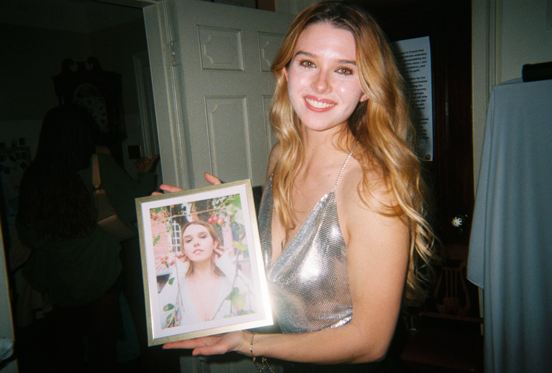 Les Adore model Zoe Benham holds up the cover of "Les Adore."