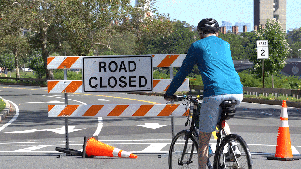 A biker rides down Memorial Drive during one of the Sunday closures.