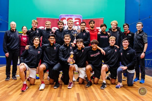 The Harvard squash team poses with its student managers.
