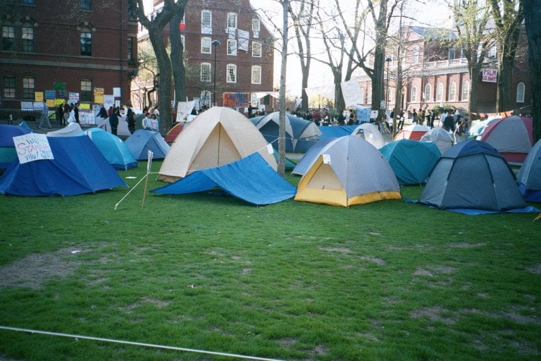 Students built a 'Tent City' in Harvard Yard during the 2001 living wage campaign, maintaining a 24-hour protest outside Massachusetts Hall.
