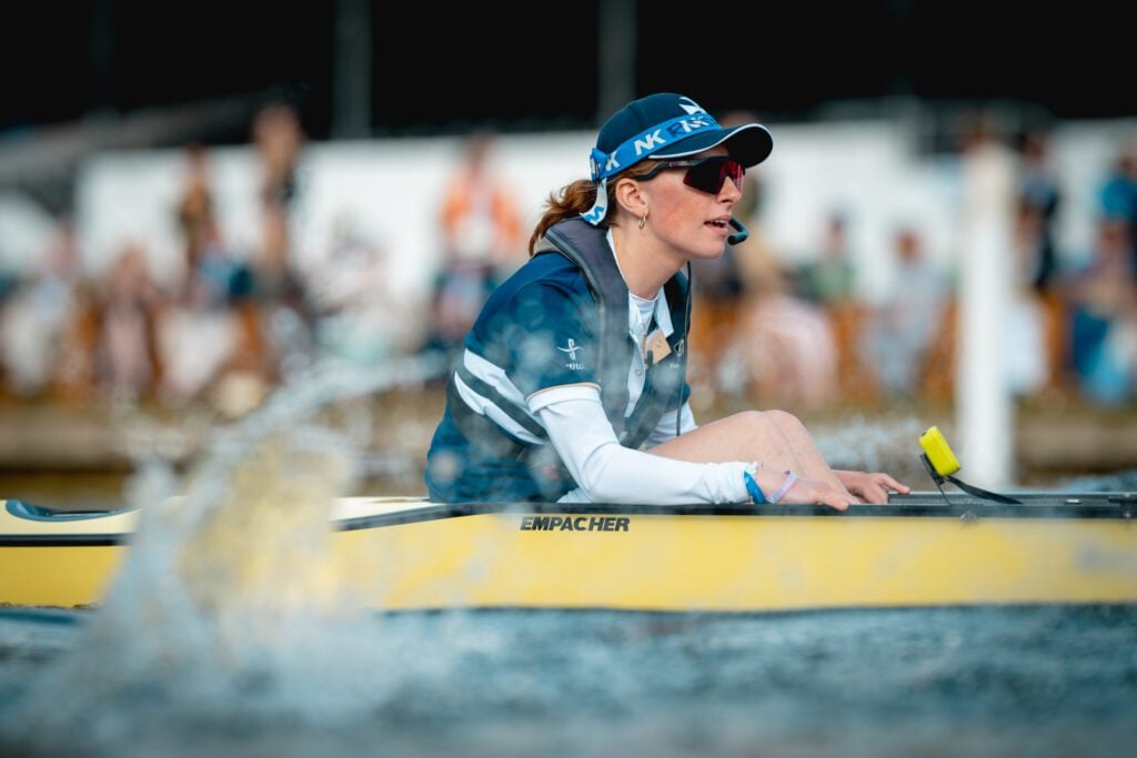 Natalia Toms leads her boat through the water.